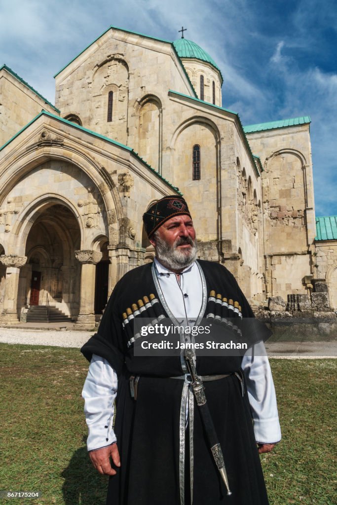 Proud Georgian man, in traditional Cossack dress, outside Bagrati Cathedral, Kutaisi, Georgia (Model Release)