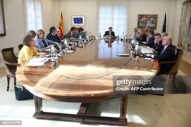 Spanish Prime Minister Mariano Rajoy chairs a cabinet meeting at La Moncloa palace in Madrid on October 27, 2017. Spanish Prime Minister Mariano...