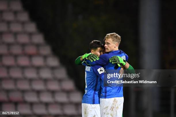 Julian RiedelÂ and Oliver HuesingÂ of Hansa Rostock celebrate after the final whistle of the 3. Liga match between SpVgg Unterhaching and F.C. Hansa...