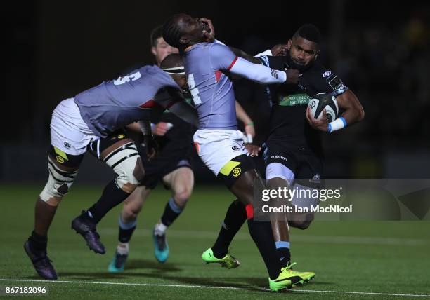 Niko Matawalu of Glasgow Warriors is tackled by Yaw Penxe of Southern Kings during the Glasgow Warriors and Southern Kings Guinness Pro 14 match at...