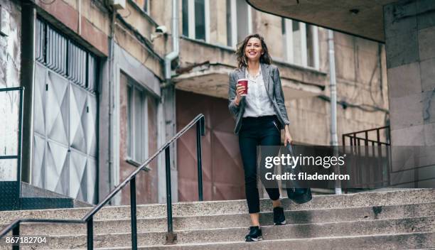 going to work - woman standing looking down stock pictures, royalty-free photos & images