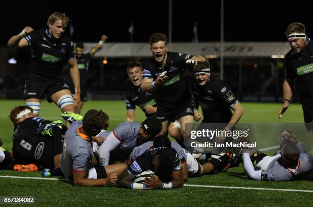 George Horne of Glasgow Warriors celebrates as Niko Matawalu of Glasgow Warriors scores his team's second try during the Glasgow Warriors and...