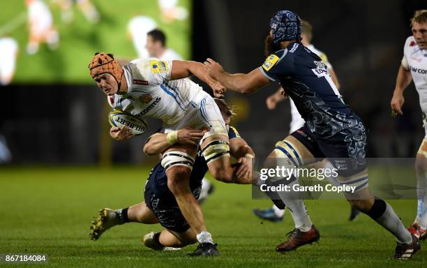 Ollie Atkins of Exeter gets past Josh Strauss of Sale during the Aviva Premiership match between Sale Sharks and Exeter Chiefs at AJ Bell Stadium on...