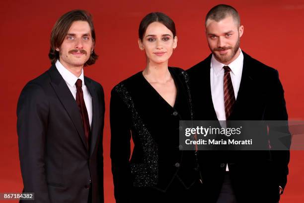 Luca Marinelli, Valentina Belle and Lorenzo Richelmy walk a red carpet for 'Una Questione Privata Red' during the 12th Rome Film Fest at Auditorium...