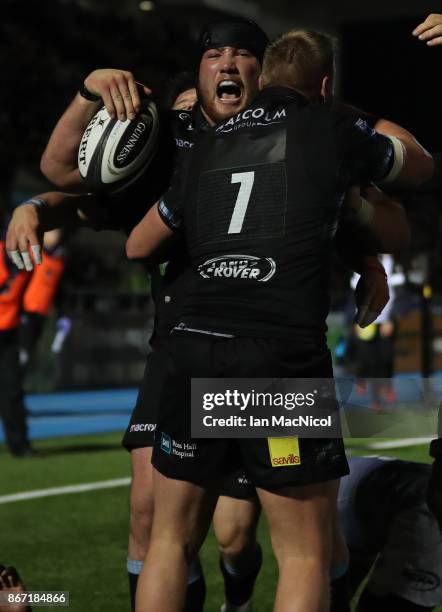 Zander Fagerson of Glasgow Warriors celebrates after he runs through to score his team's fourth try during the Glasgow Warriors and Southern Kings...