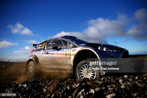 Pierre-Louis Loubet of France drives with co-driver Vincent Landais of France during day one of the FIA World Rally Championship Great Britain on...