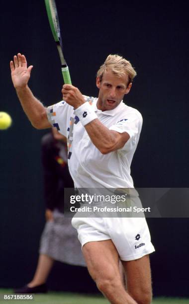 Thomas Muster of Austria in action against Olivier Delaitre of France during their First Round match in the Wimbledon Lawn Tennis Championships at...