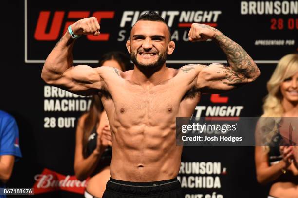 John Lineker of Brazil poses on the scale during the UFC Fight Night Weigh-in inside the Ibirapuera Gymnasium on October 27, 2017 in Sao Paulo,...