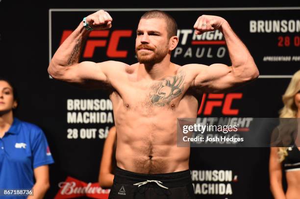 Jim Miller poses on the scale during the UFC Fight Night Weigh-in inside the Ibirapuera Gymnasium on October 27, 2017 in Sao Paulo, Brazil.