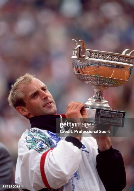 Thomas Muster of Austria lifts the trophy after defeating Michael Chang of the USA in the Men's Singles Final of the French Open Tennis Championships...