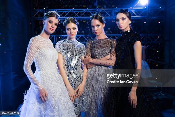 Models backstage ahead of the Atelier Zuhra show during Fashion Forward October 2017 held at the Dubai Design District on October 27, 2017 in Dubai,...