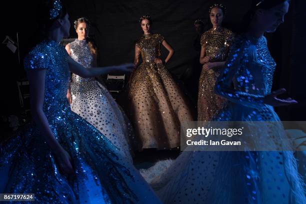 Models backstage ahead of the Atelier Zuhra show during Fashion Forward October 2017 held at the Dubai Design District on October 27, 2017 in Dubai,...