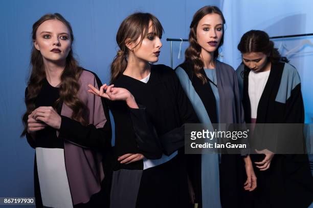 Models backstage ahead of the Utruj Presentation during Fashion Forward October 2017 held at the Dubai Design District on October 27, 2017 in Dubai,...
