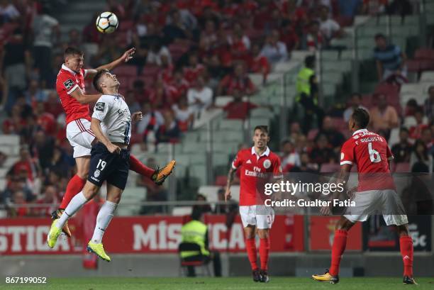 Benfica defender Ruben Dias from Portugal with CD Feirense forward Joao Silva from Portugal in action during the Primeira Liga match between SL...