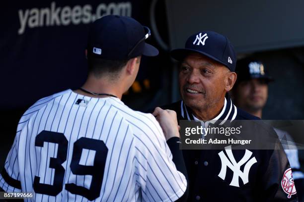 Tyler Wade of the New York Yankees fist bumps Reggie Jackson former New York Yankees prior to a game against the Toronto Blue Jays at Yankee Stadium...