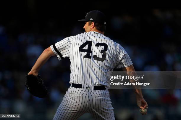 Adam Warren of the New York Yankees pitches against the Toronto Blue Jays during the sixth inning at Yankee Stadium on October 1, 2017 in the Bronx...