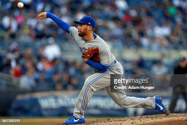 Danny Barnes of the Toronto Blue Jays pitches against the New York Yankees during the seventh inning at Yankee Stadium on October 1, 2017 in the...