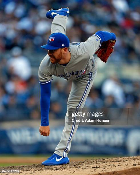 Danny Barnes of the Toronto Blue Jays pitches against the New York Yankees during the seventh inning at Yankee Stadium on October 1, 2017 in the...