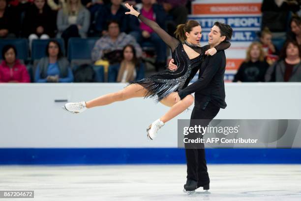 Alisa Agafonova and Alper Ucar of Turkey perform their short program at the 2017 Skate Canada International ISU Grand Prix event in Regina,...