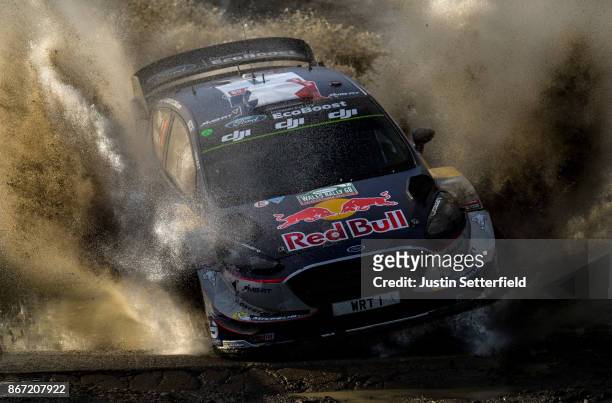 Sebastien Ogier of France and M-Sport World Rally Team drives with co-driver Julien Ingrassia of France during the Sweet Lamb stage of the FIA World...