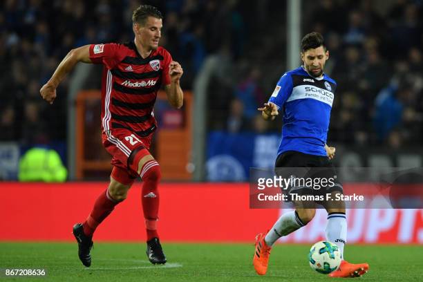 Stefan Kutschke of Ingolstadt and Stephan Salger of Bielefeld fight for the ball during the Second Bundesliga match between DSC Arminia Bielefeld and...