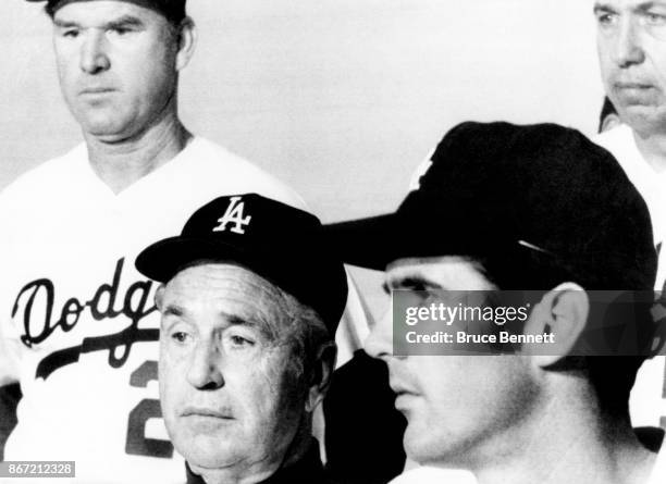 Manager Walter Alston of the Los Angeles Dodgers sits during a press conference announcing he will be the manager for the 1971 season as Bill Singer...