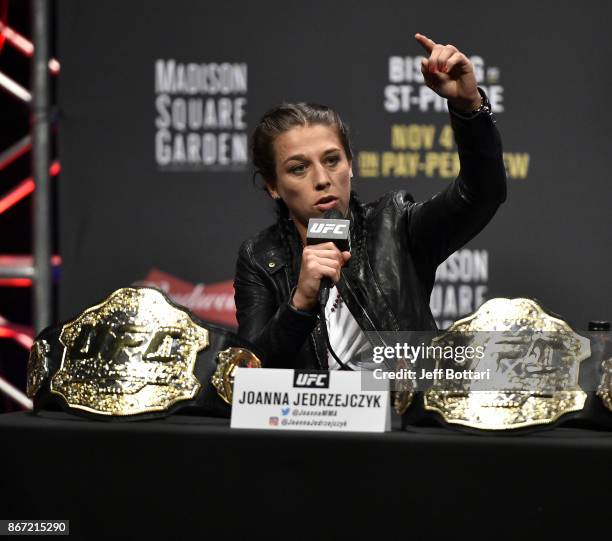 Strawweight champion Joanna Jedrzejczyk of Poland interacts with fans and media during the UFC 217 news conference inside T-Mobile Arena on October...