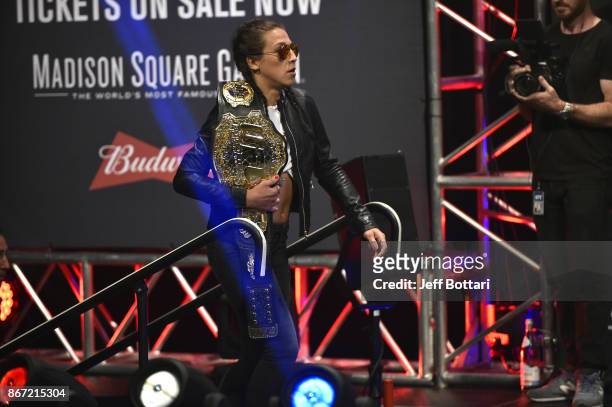 Strawweight champion Joanna Jedrzejczyk of Poland interacts with fans and media during the UFC 217 news conference inside T-Mobile Arena on October...