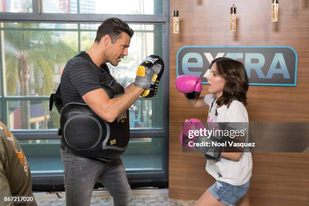 Millie Bobby Brown spars with Mark Wright at "Extra" at Universal Studios Hollywood on October 27, 2017 in Universal City, California.