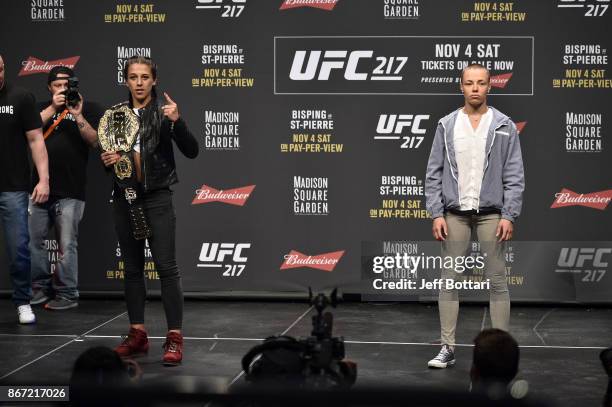 Opponents Joanna Jedrzejczyk and Rose Namajunas pose for photos during the UFC 217 news conference inside T-Mobile Arena on October 6, 2017 in Las...