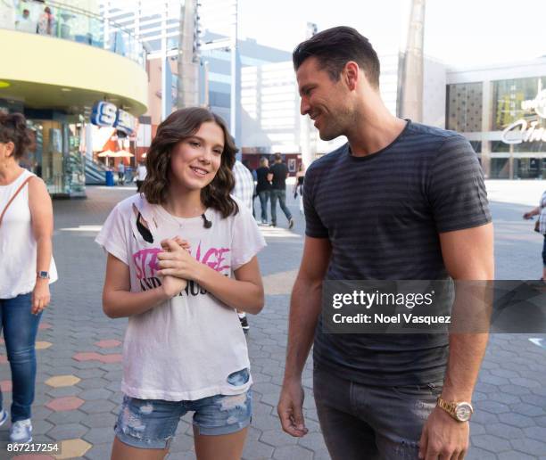 Millie Bobby Brown and Mark Wright visit "Extra" at Universal Studios Hollywood on October 27, 2017 in Universal City, California.