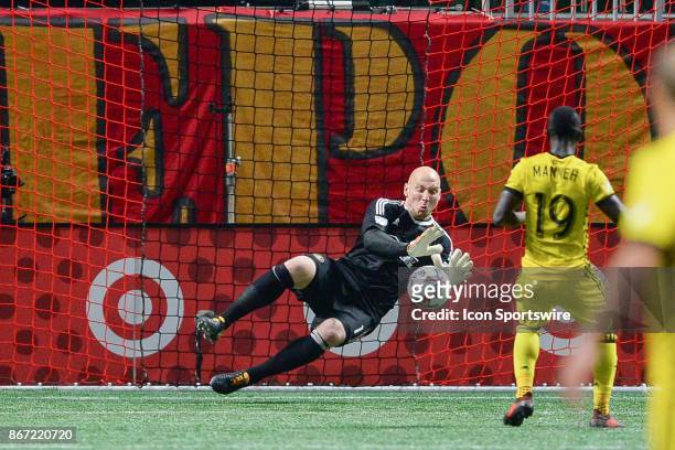 Atlanta goalkeeper Brad Guzan blocks the penalty kick of Columbus' Kekuta Manneh during the playoff match between Atlanta United and Columbus Crew on...