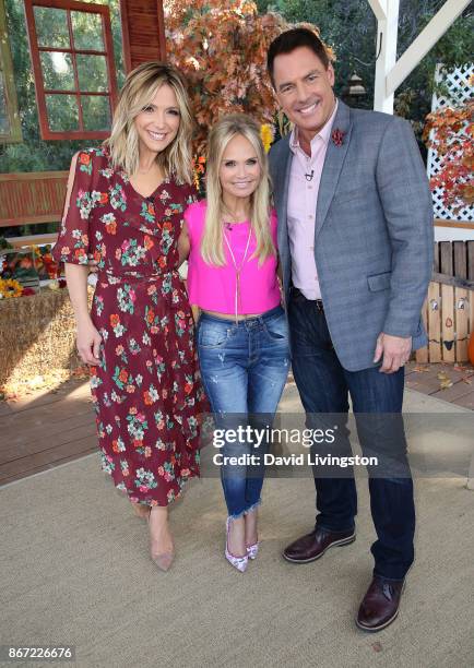 Hosts Debbie Matenopoulos and Mark Steines pose with actress Kristin Chenoweth at Hallmark's "Home & Family" at Universal Studios Hollywood on...
