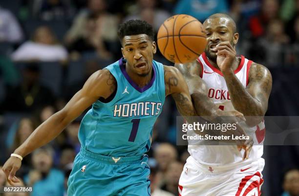 Tucker of the Houston Rockets goes after a loose ball against Malik Monk of the Charlotte Hornets during their game at Spectrum Center on October 27,...