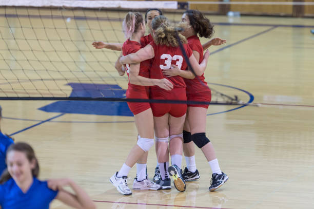 victory celebration! - girls volleyball stock pictures, royalty-free photos & images