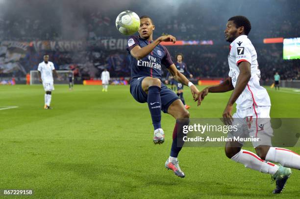 Kylian Mbappe of Paris Saint-Germain and Marlon Santos of OGC Nice fight for the ball during the Ligue 1 match between Paris Saint Germain and OGC...