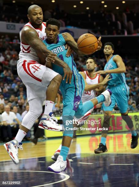 Tucker of the Houston Rockets tries to stop Malik Monk of the Charlotte Hornets during their game at Spectrum Center on October 27, 2017 in...