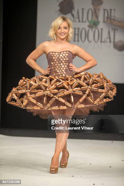 Singer Priscilla Betti walks the Runway during "Le Defile des Robes en Chocolats" during the "Salon du Chocolat Paris 2017" at Parc des Expositions...