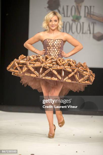 Singer Priscilla Betti walks the Runway during "Le Defile des Robes en Chocolats" during the "Salon du Chocolat Paris 2017" at Parc des Expositions...