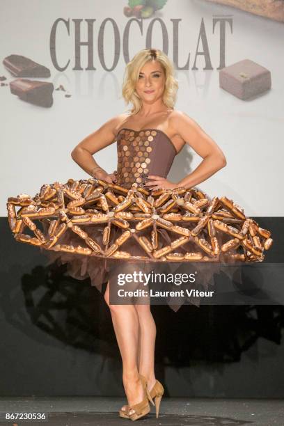 Singer Priscilla Betti walks the Runway during "Le Defile des Robes en Chocolats" during the "Salon du Chocolat Paris 2017" at Parc des Expositions...