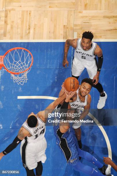 Aaron Gordon of the Orlando Magic, Danny Green of the San Antonio Spurs, and Kyle Anderson of the San Antonio Spurs vie for the ball during the game...