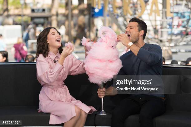 Millie Bobby Brown and Mark Wright eat cotton candy together at "Extra" at Universal Studios Hollywood on October 27, 2017 in Universal City,...