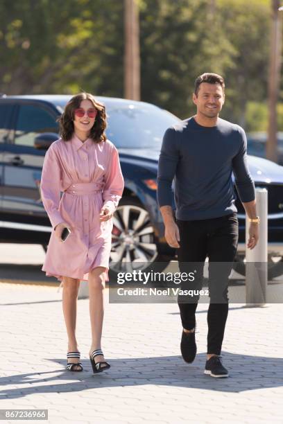 Millie Bobby Brown and Mark Wright visit "Extra" at Universal Studios Hollywood on October 27, 2017 in Universal City, California.