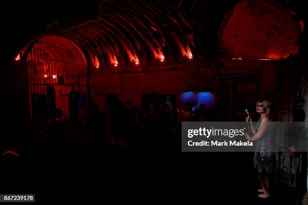 An actor sings at a speakeasy portion of "Terror Behind the Walls" haunted house on October 24, 2017 in Philadelphia, Pennsylvania. The haunted house...