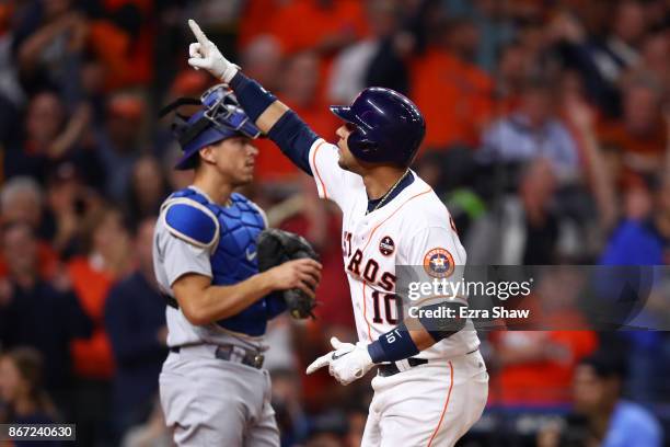 Yuli Gurriel of the Houston Astros reacts after hitting a solo home run during the second inning against the Los Angeles Dodgers in game three of the...