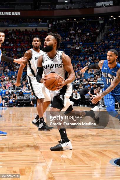 Patty Mills of the San Antonio Spurs drives to the basket against the Orlando Magic on October 27, 2017 at Amway Center in Orlando, Florida. NOTE TO...