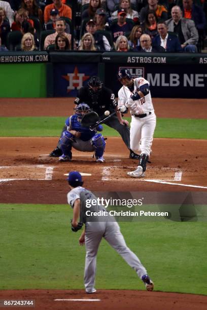 Yuli Gurriel of the Houston Astros hits a solo home run during the second inning against the Los Angeles Dodgers in game three of the 2017 World...