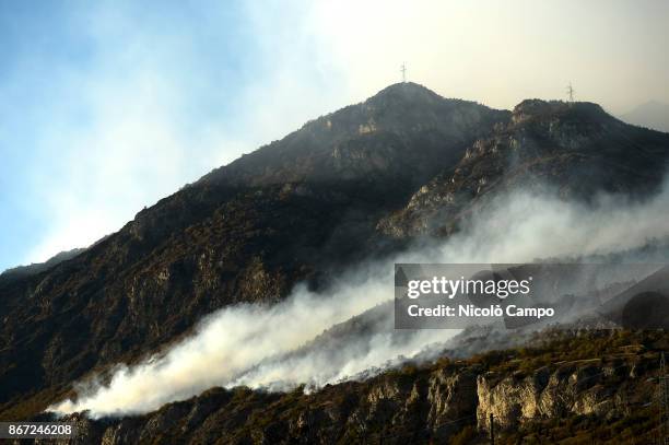 Fire burns in a mountain of the Susa Valley near Turin. The fires have been burning for several days favored by strong wind and drought, so smoke has...