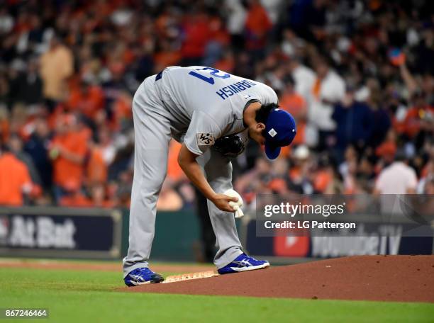 Yu Darvish of the Los Angeles Dodgers grabs the rosin bag during Game 3 of the 2017 World Series against the Houston Astros at Minute Maid Park on...