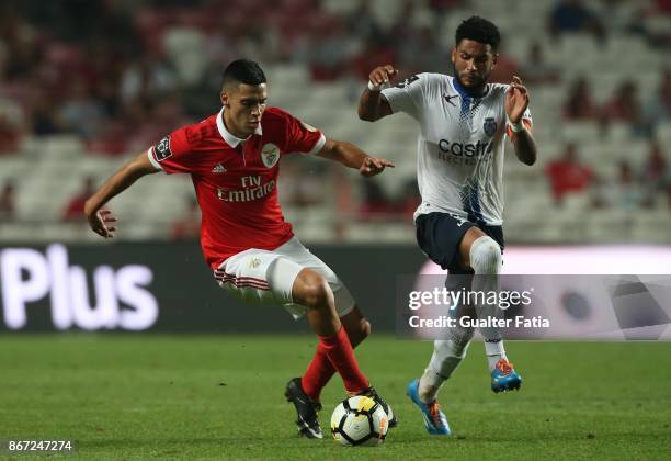 Benfica forward Raul Jimenez from Mexico with CD Feirense midfielder Babanco from Cape Verde in action during the Primeira Liga match between SL...